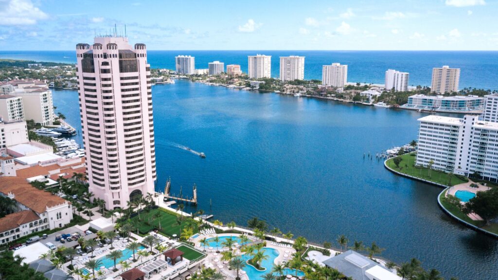 Scenic waterfront view of Boca Raton, Florida, featuring luxury high-rises and boating areas near Boca Raton bail bonds services.